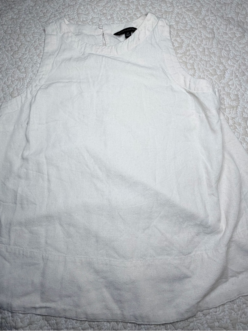 White sleeveless top